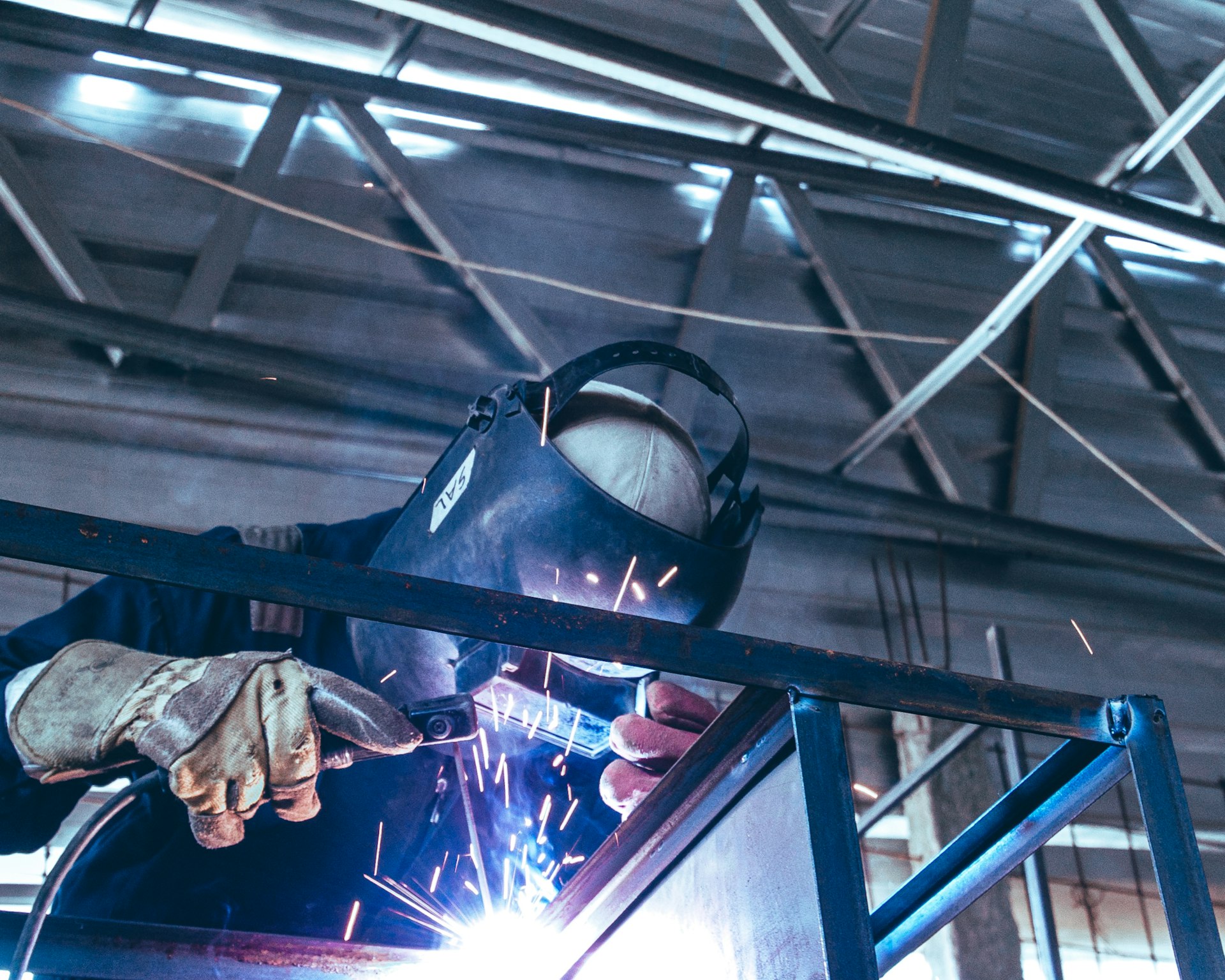 a welder working on a piece of metal